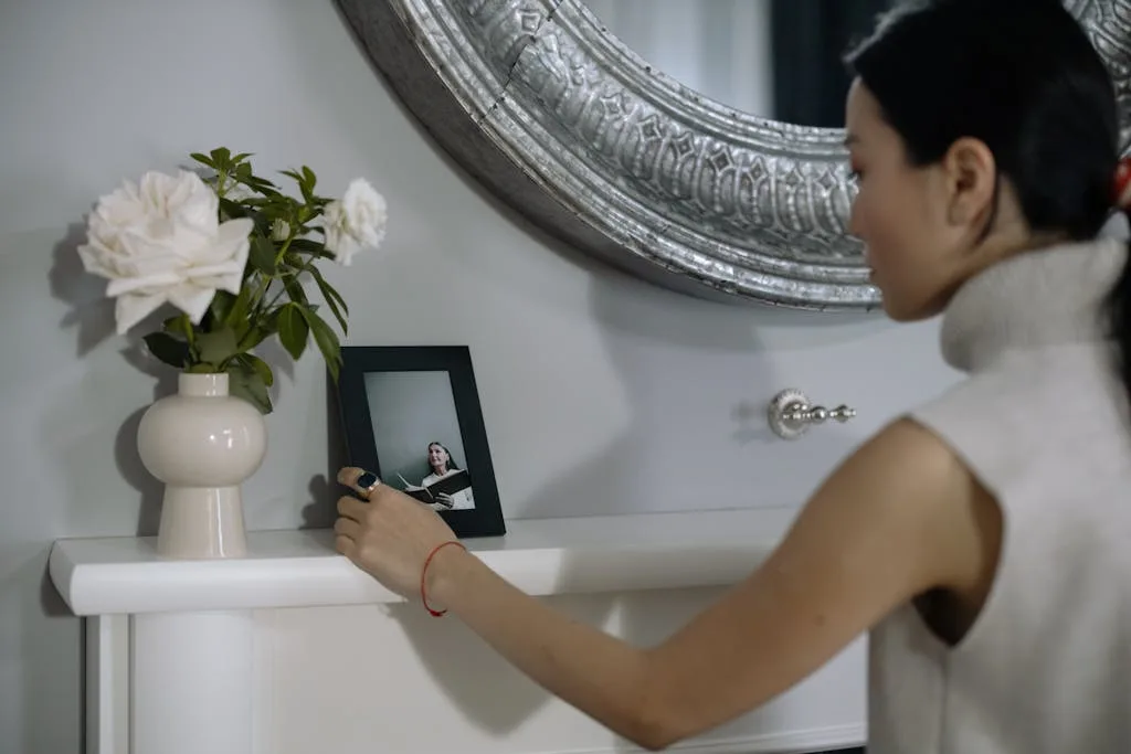 Left & Right Ear Itching Meaning, Superstition Spiritually 8 Woman Looking at the Photo in the Picture Frame